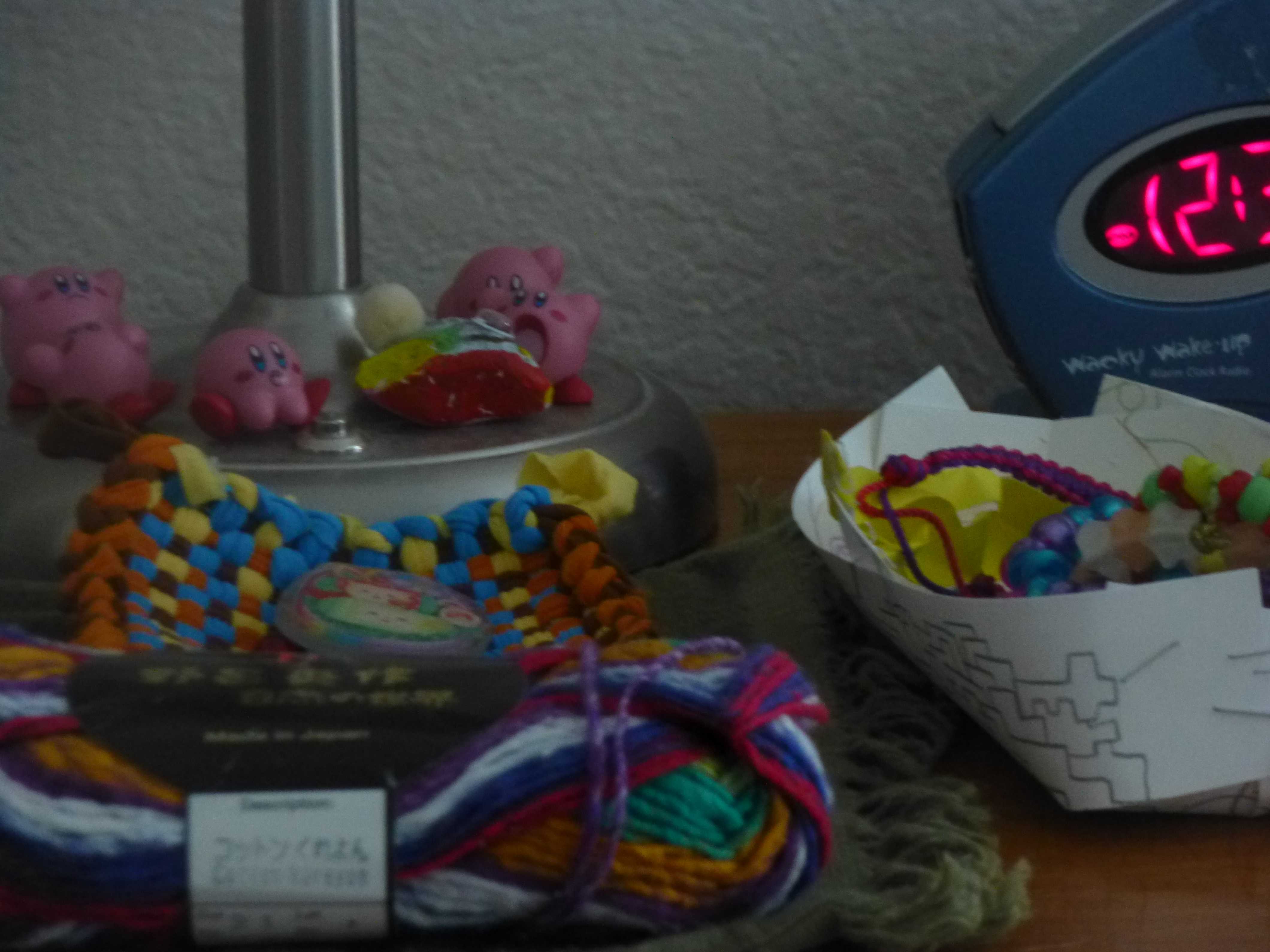 my dresser with alarm clock, kirby's bracelets, etc.